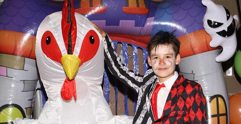 Person dressed as a chicken and another boy dressed as a court jester.