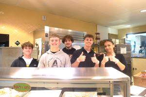 Hope Squad team members prepare to serve breakfast to all students.
