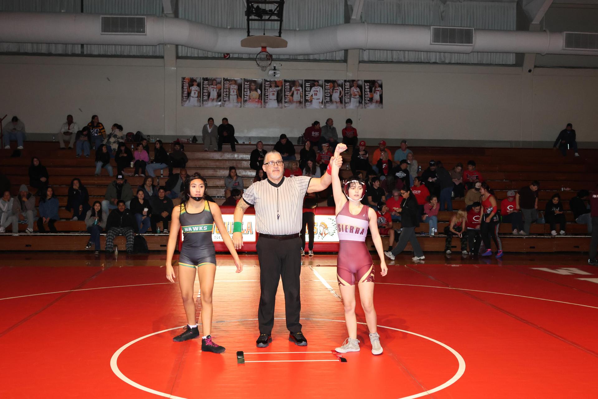 Wrestling winners with hands up 48