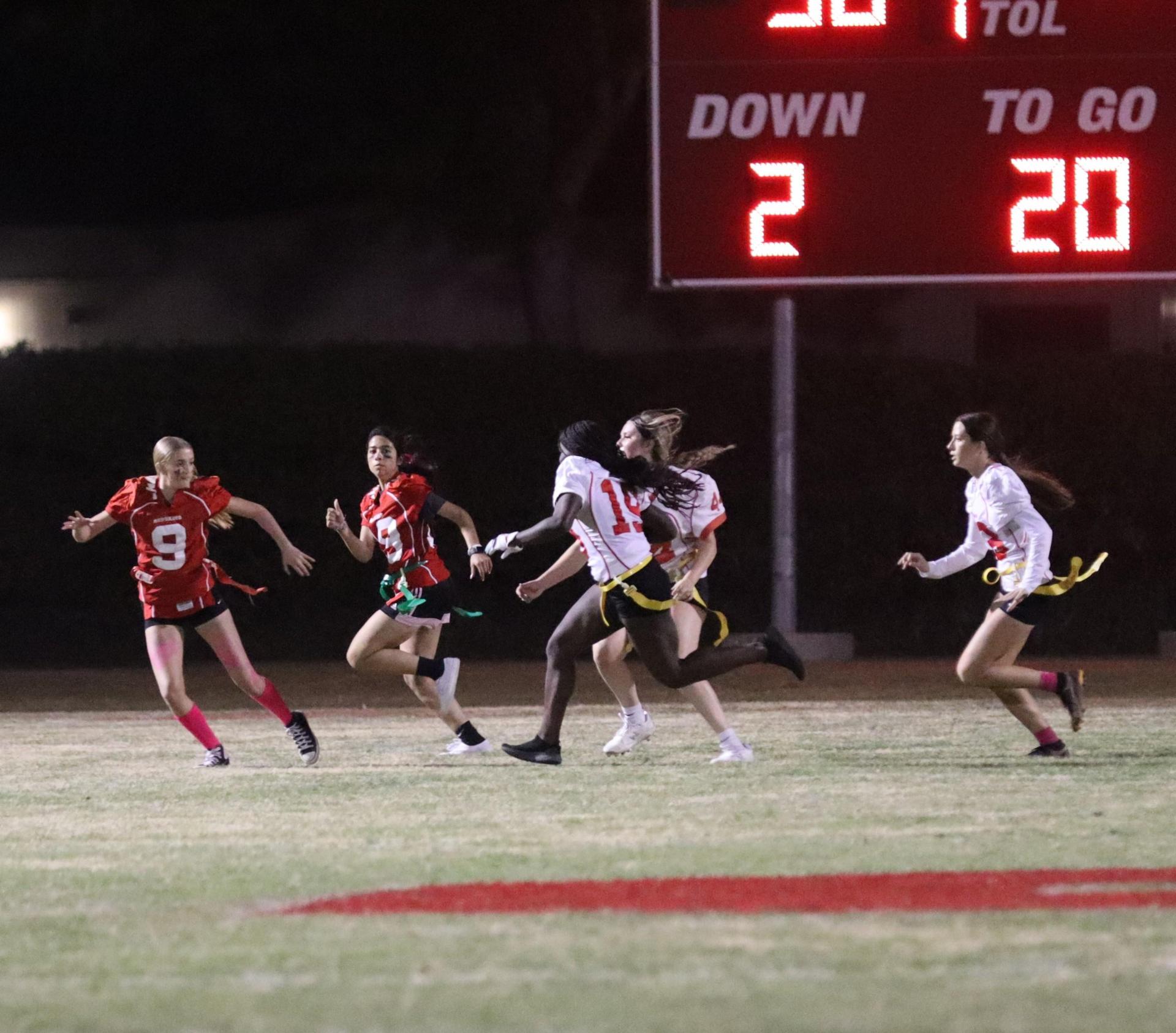 girls playing flag football