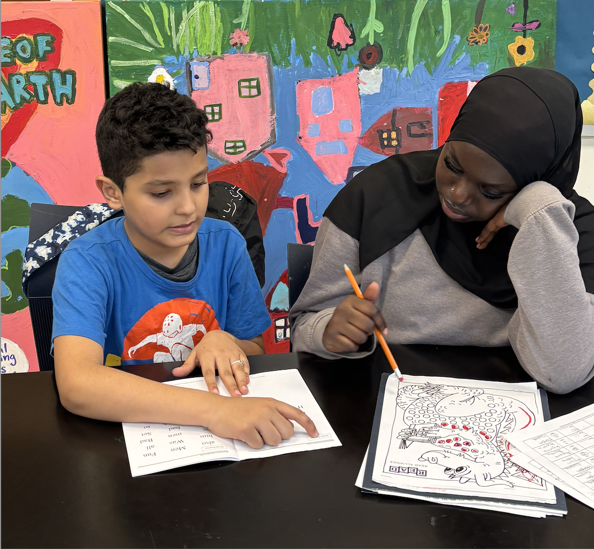 Student receiving individual reading tutoring support