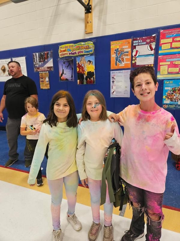 Students covered in chalk after the color run