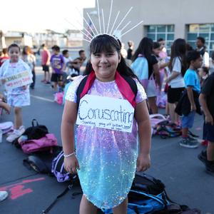 student dressed in sparkles with depicting word "coruscating"