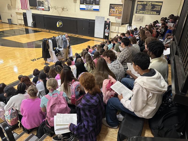 Seniors listen to Mr. Greg explain the senior packet of information