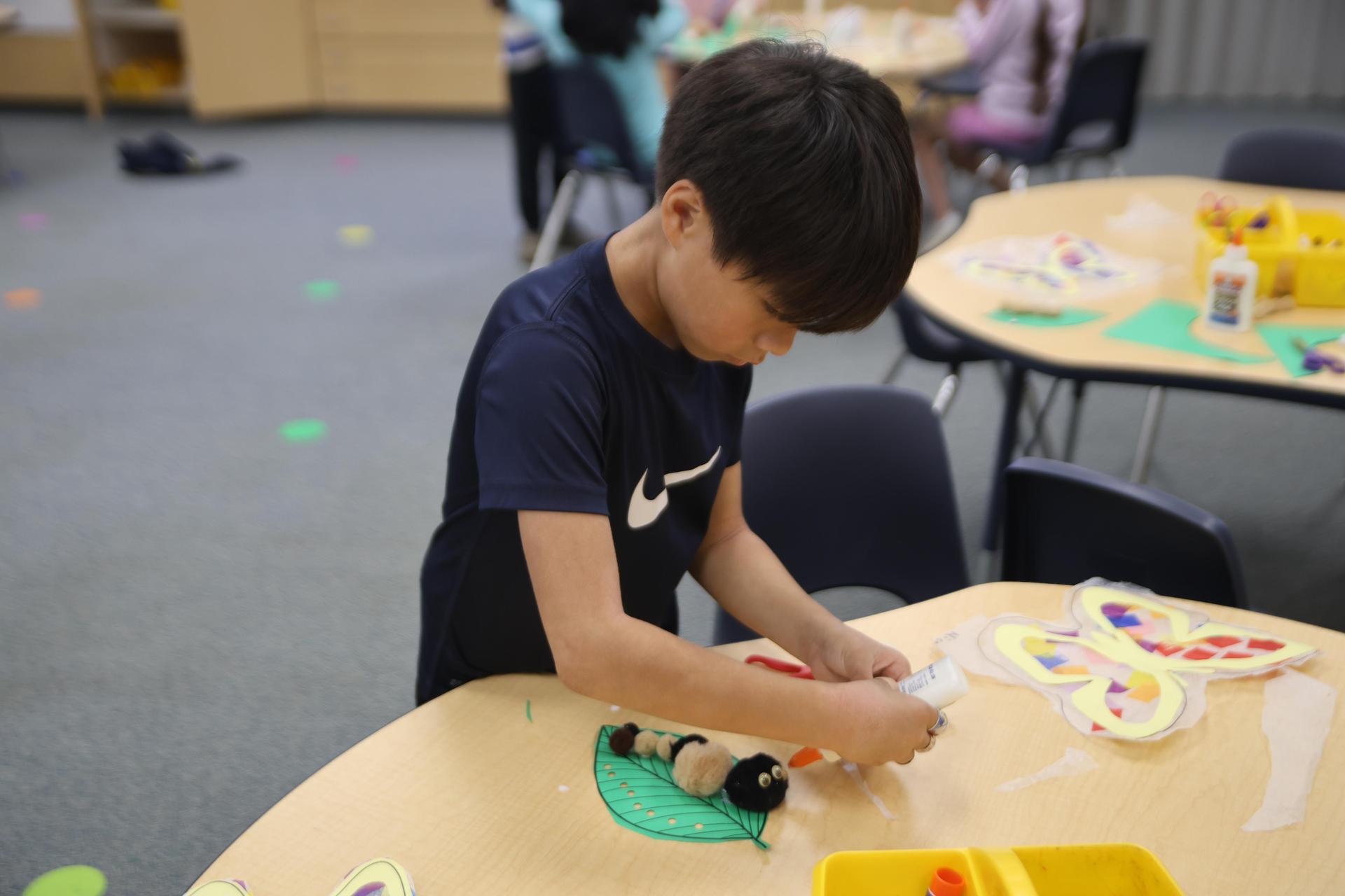 Little boy in class art project. 