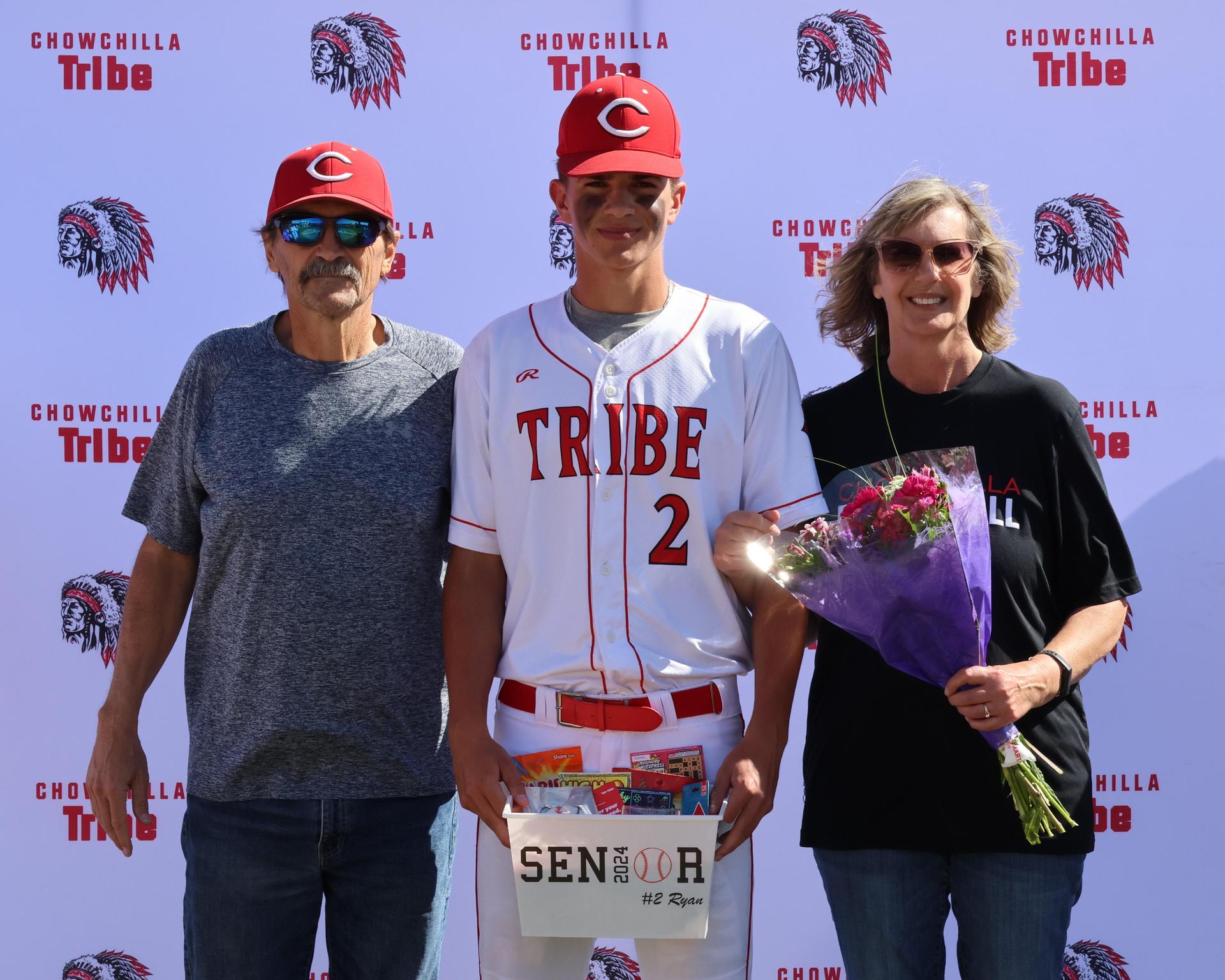 Seniors Posing With Teammates, Coaches, And Family