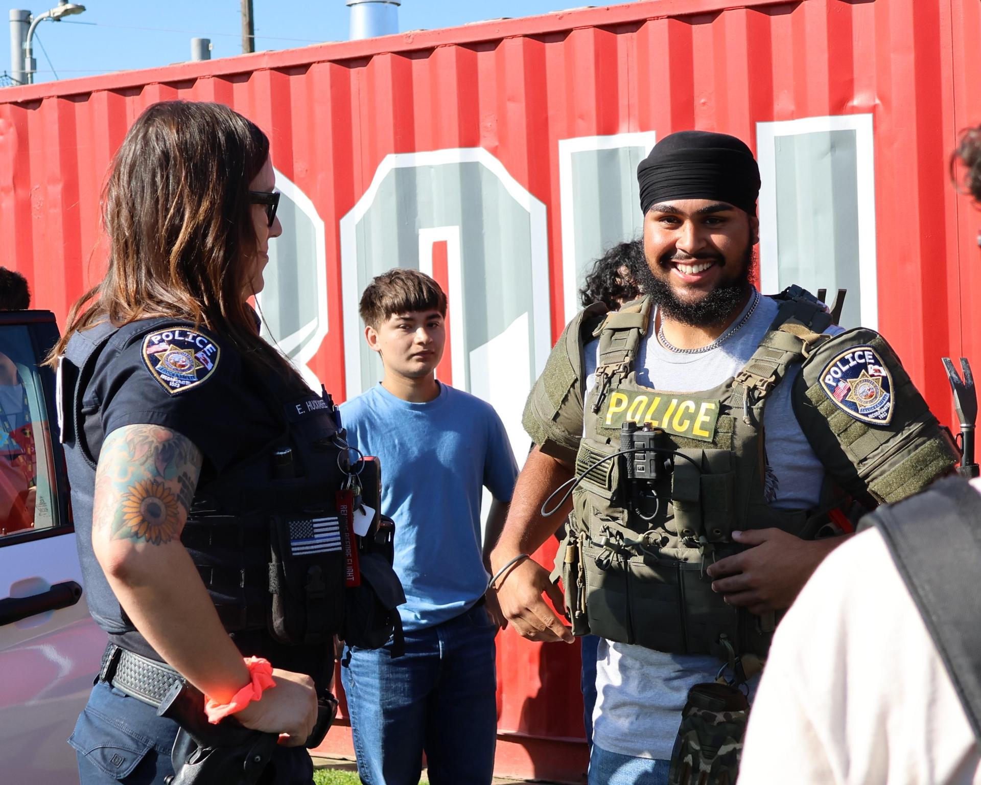 Chowchilla police officers talking to students
