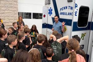 Penn Township Ambulance Assistant Chief, Ryan Satira, tells the students about his job as a paramedic