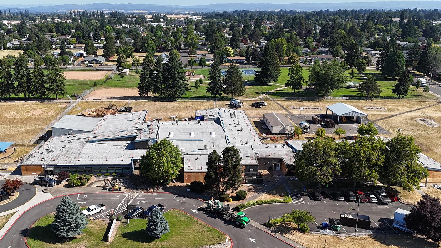 front aerial view of building with exposed siding