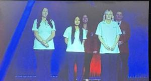 Smiling students with awards