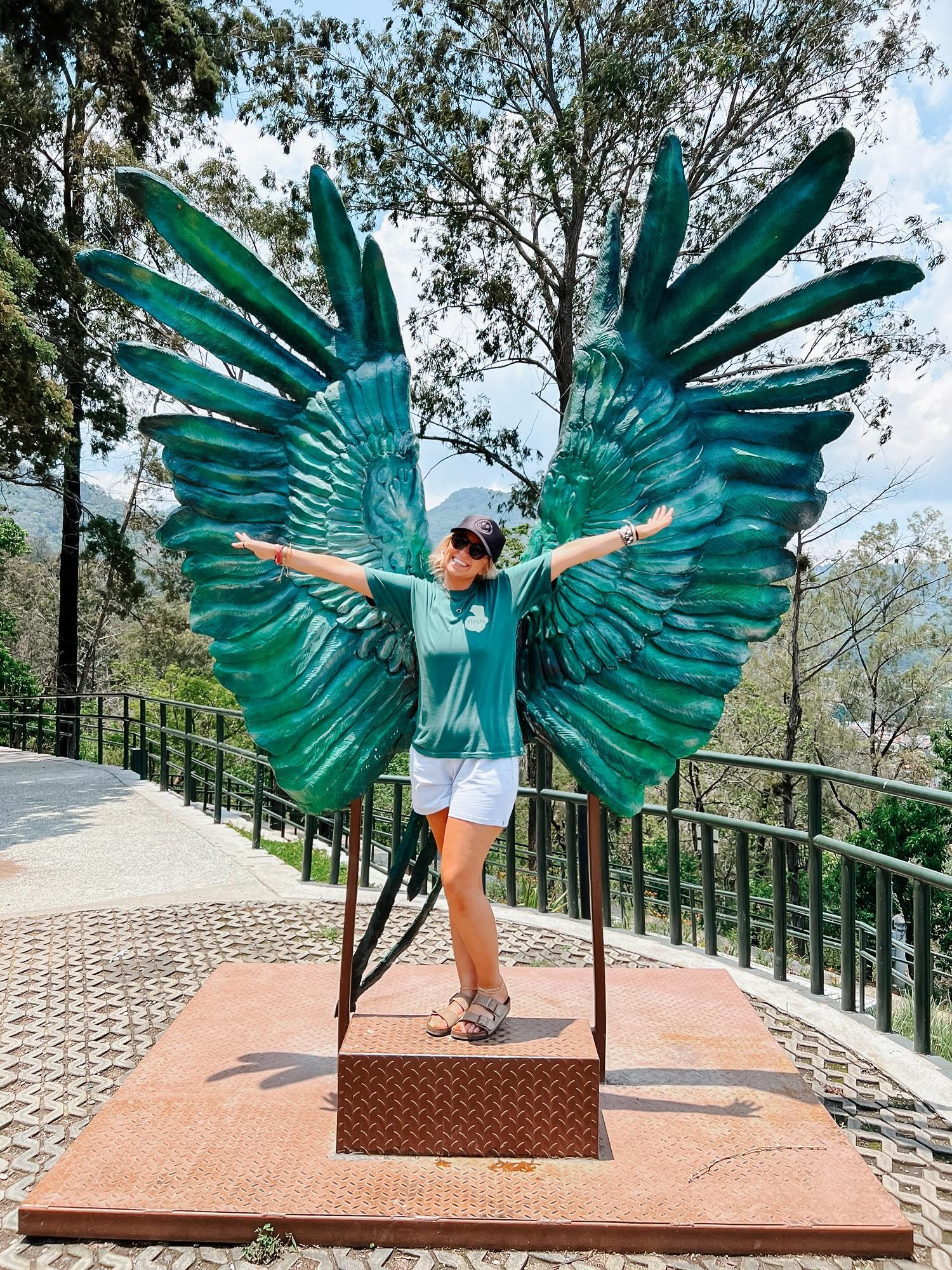 Mrs. Harris in front of wings.
