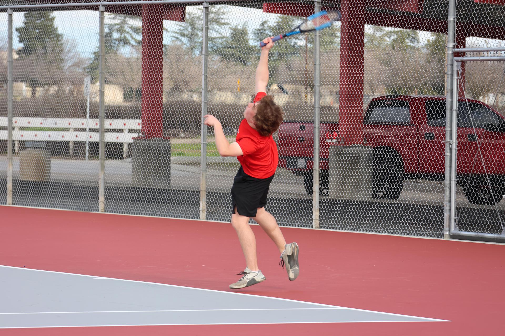 CUHS Boys playing tennis against coalinga