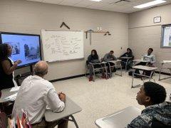 Students listening to the presenter talk.