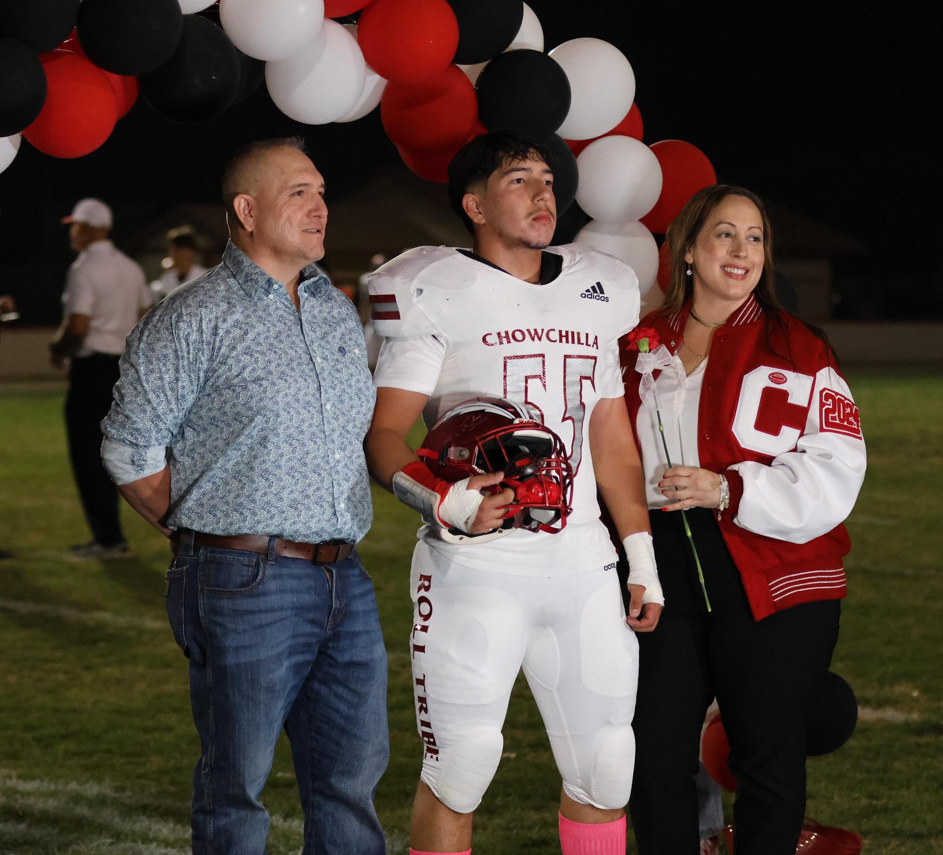 seniors and their escorts celebrating senior night