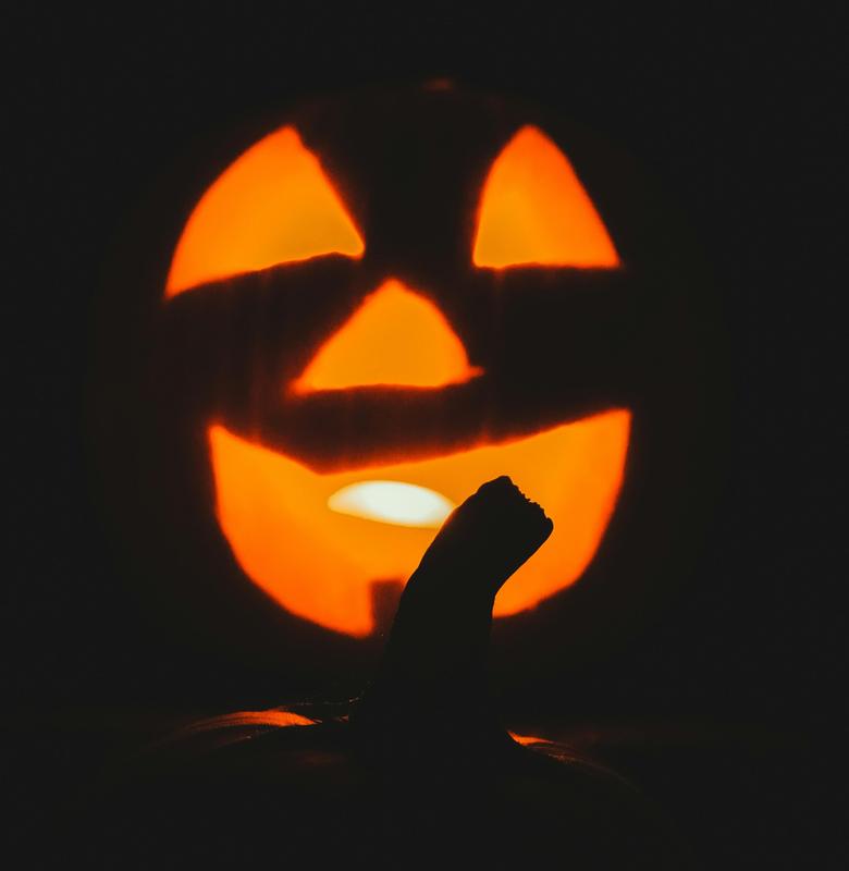 silhouette of a pumpkin with light