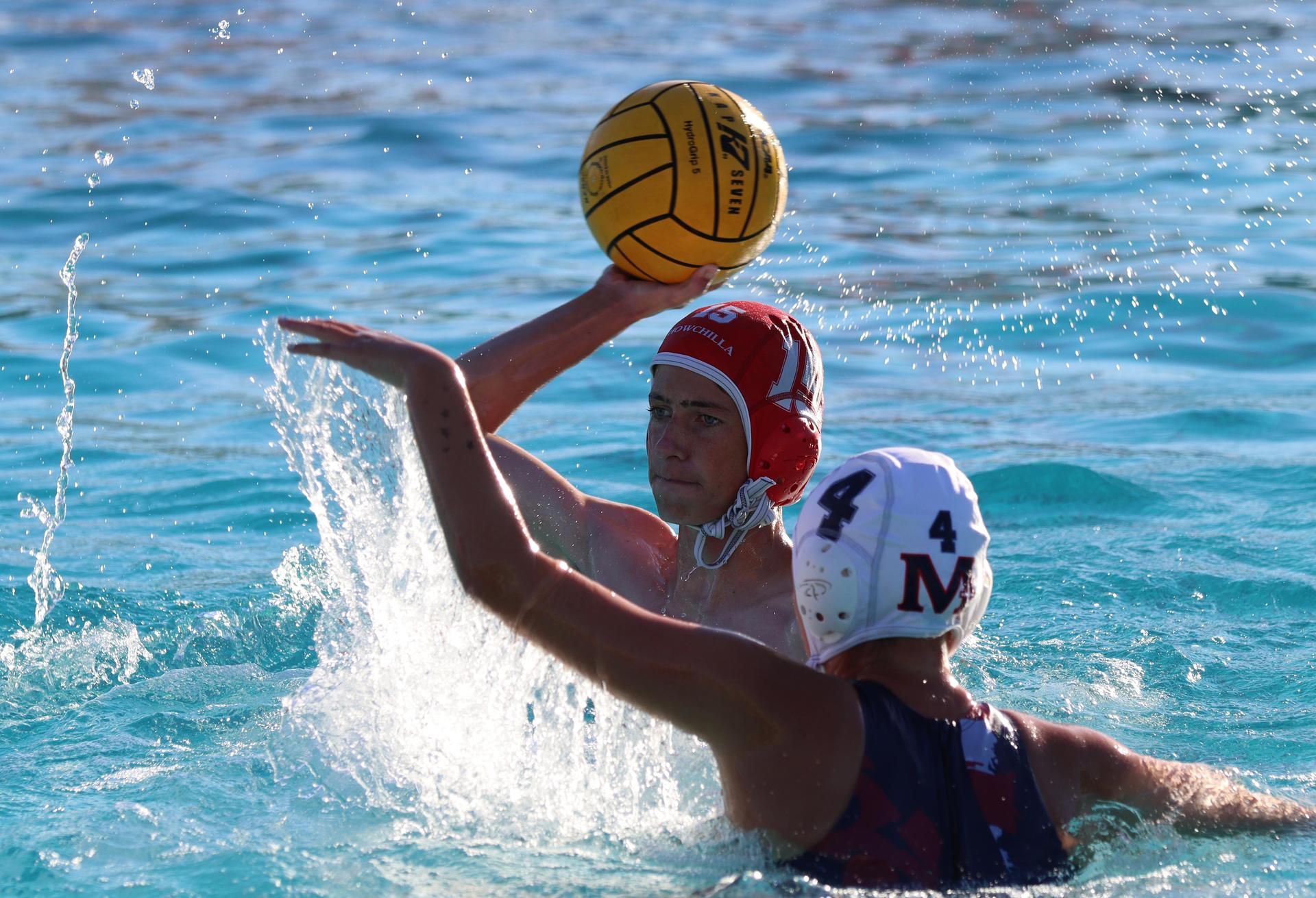 boys water polo players in action against san joaquin memorial