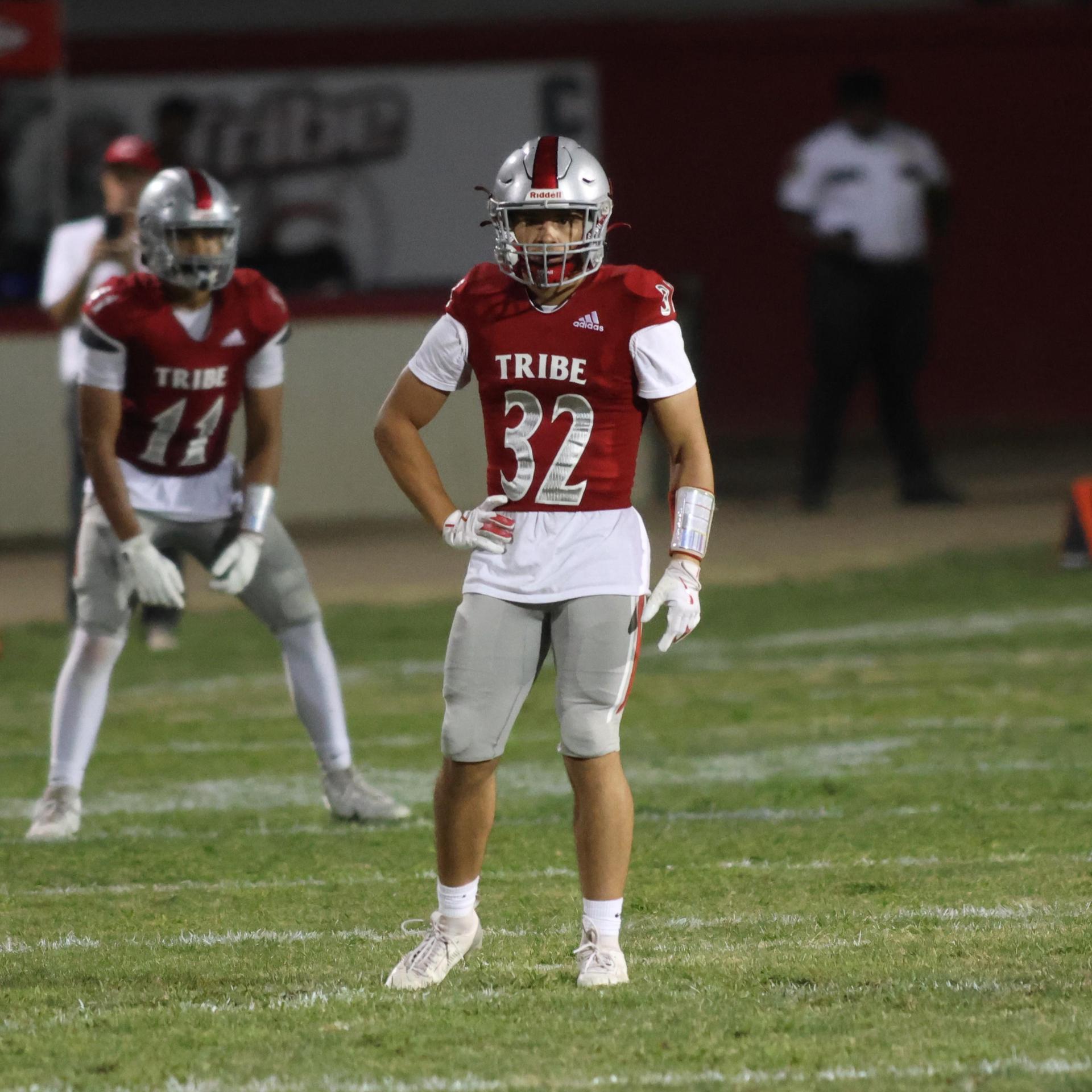 Varsity football players in action against Parlier 143