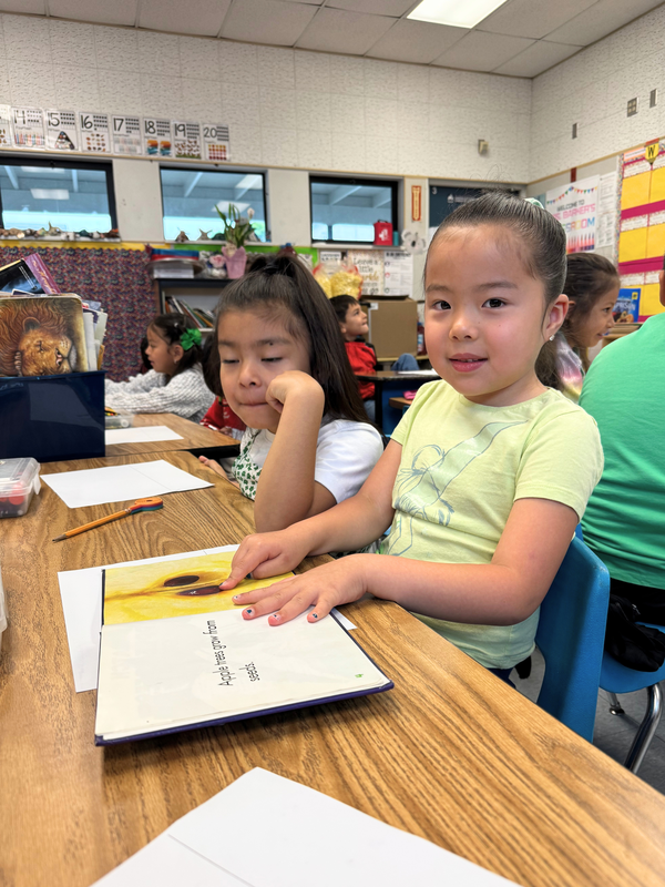 Kenmore 2026 Kinder student reads book