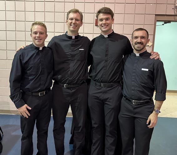 St. Joseph alumni studying to be Catholic priests attending the Homegrown Harvest Festival at St. Francis of Assisi Catholic Church Oct. 11.