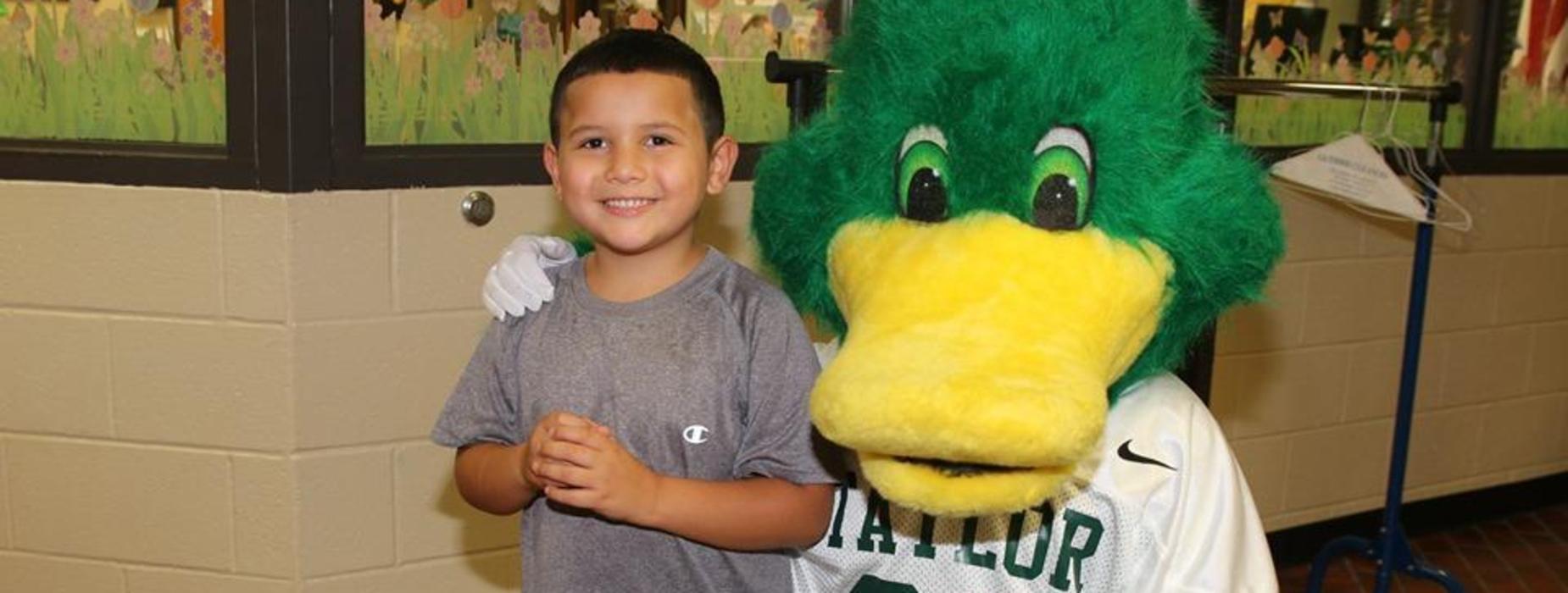 student with duck mascot
