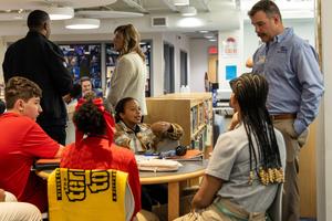Students speak with a US Steel rep