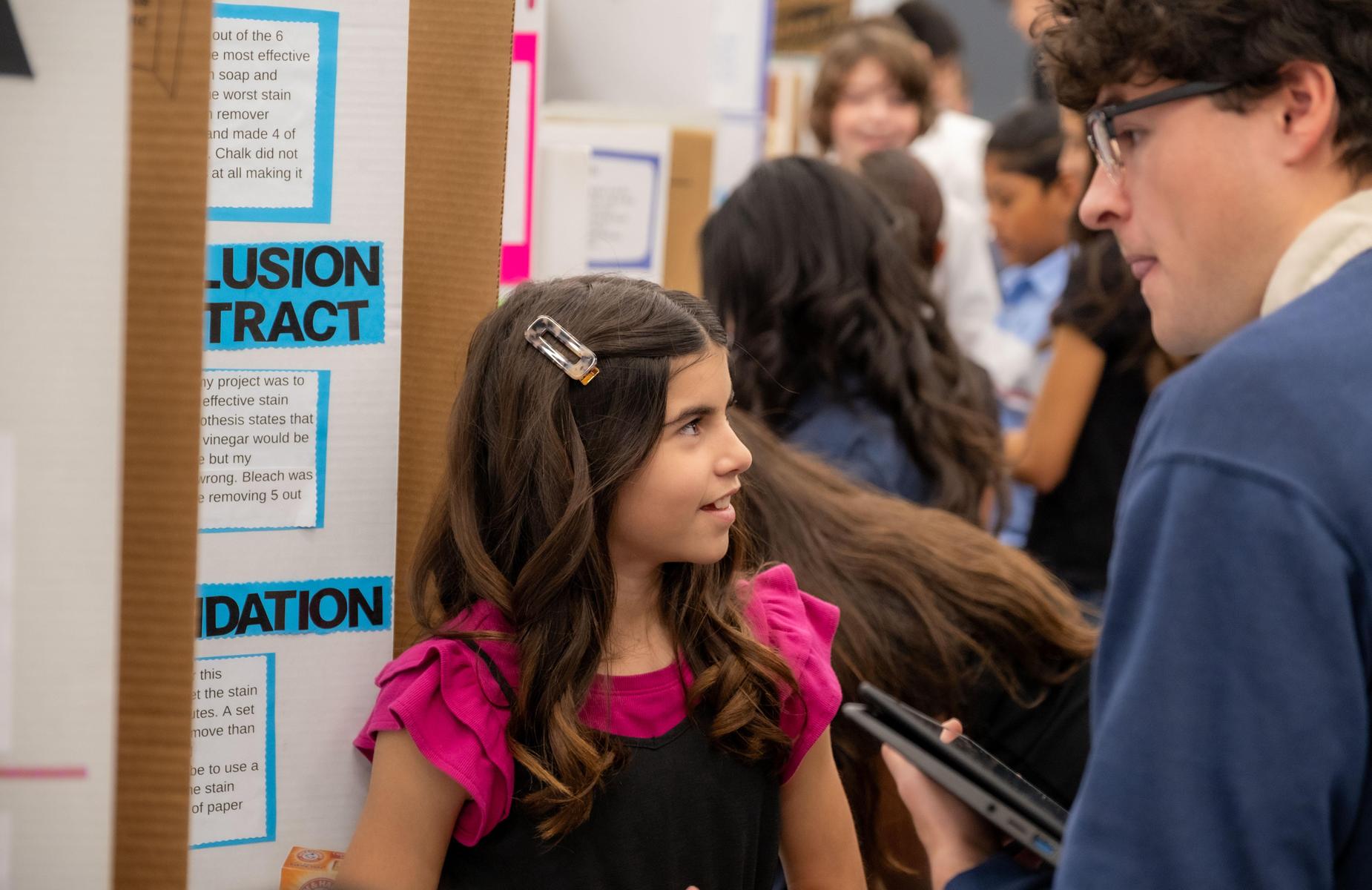 student with judge at fair