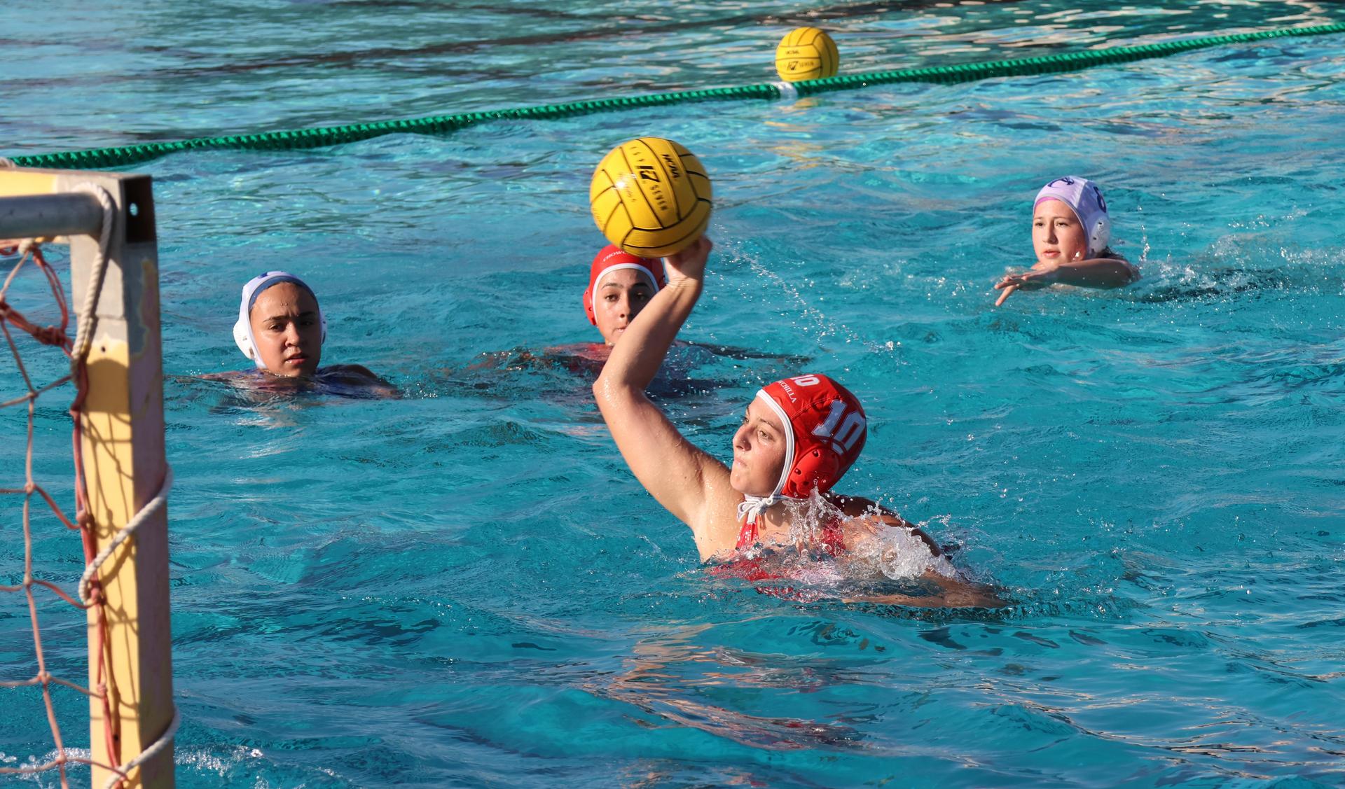 girls playing water polo against Sanger West