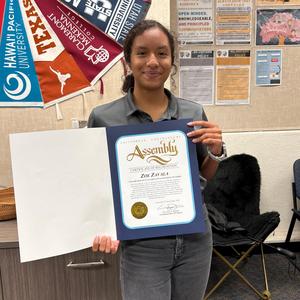 Zoe Zavala holding a California State Assembly certificate