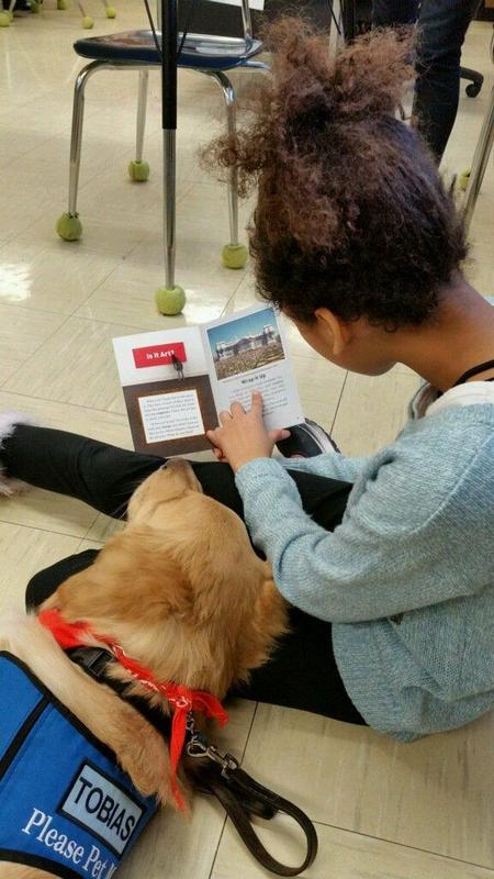 Student Reading to Dog