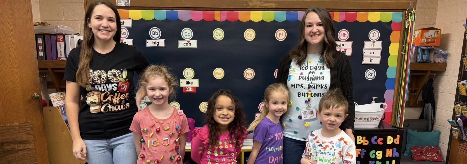 Students and Teachers wearing 100th day shirts.