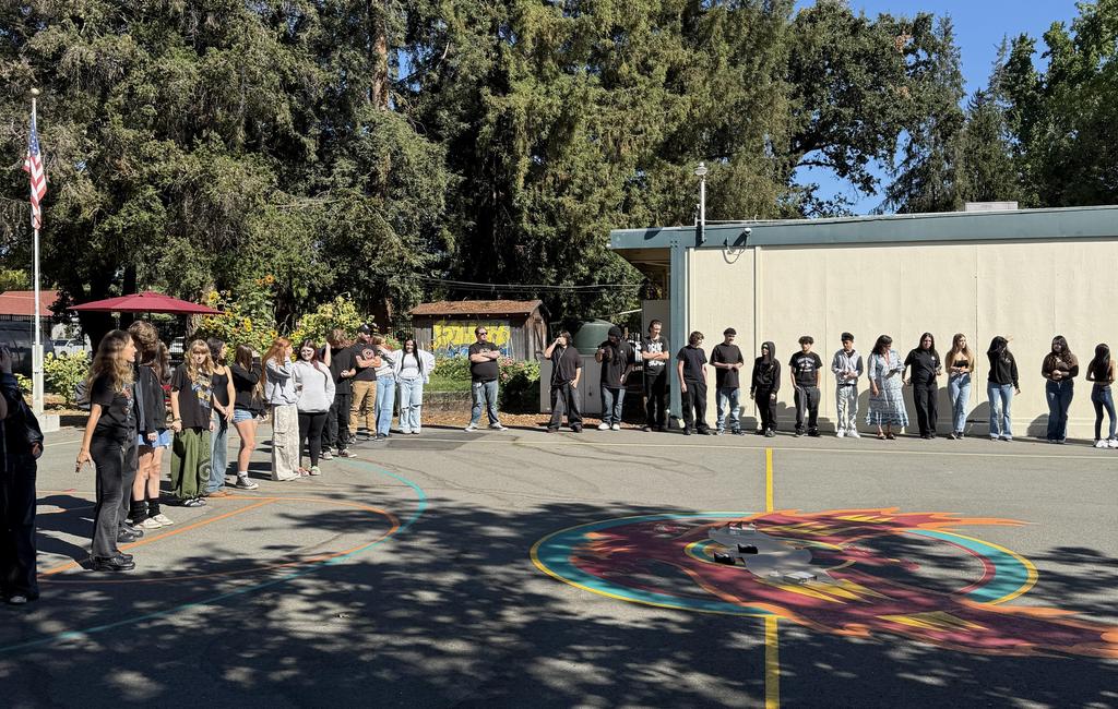 Students gather around circle