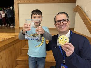 child and kneeling adult