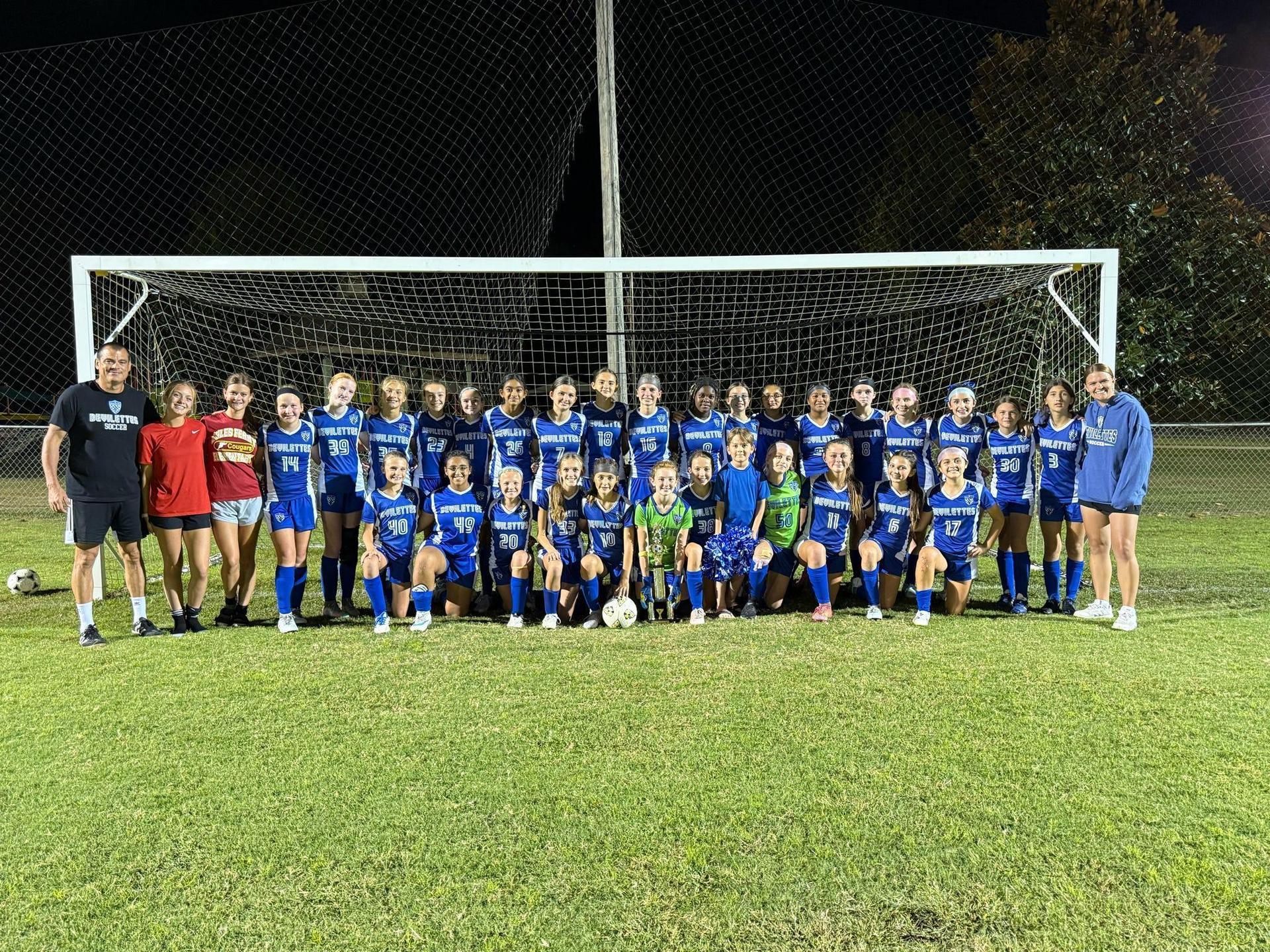 A team photo of our Girls Soccer team and Highland Rim Conference Champions