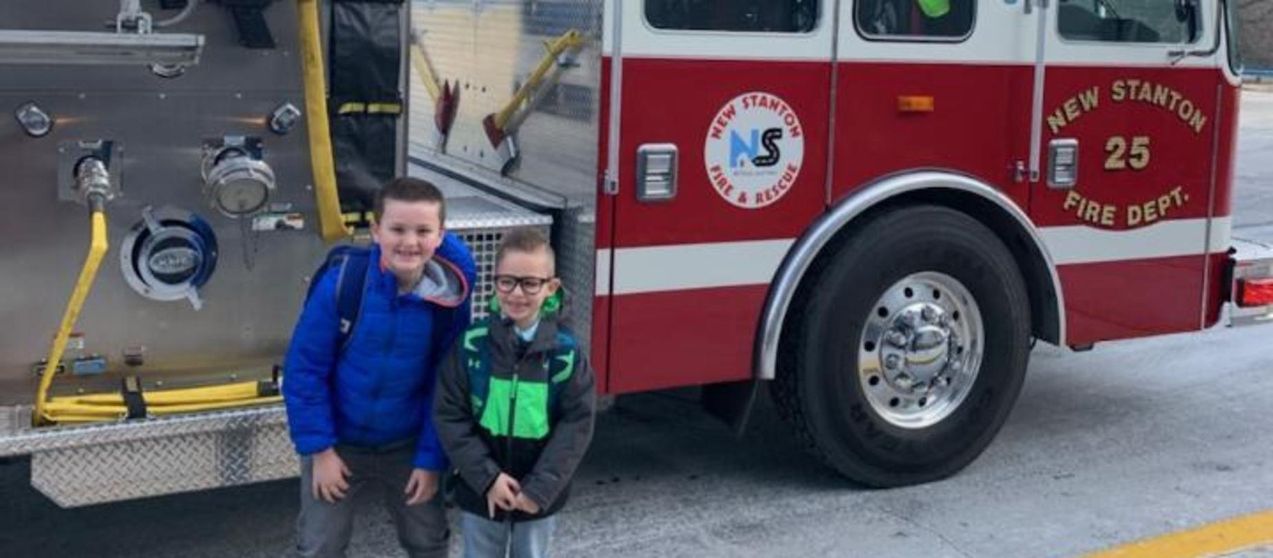 students in front of fire truck