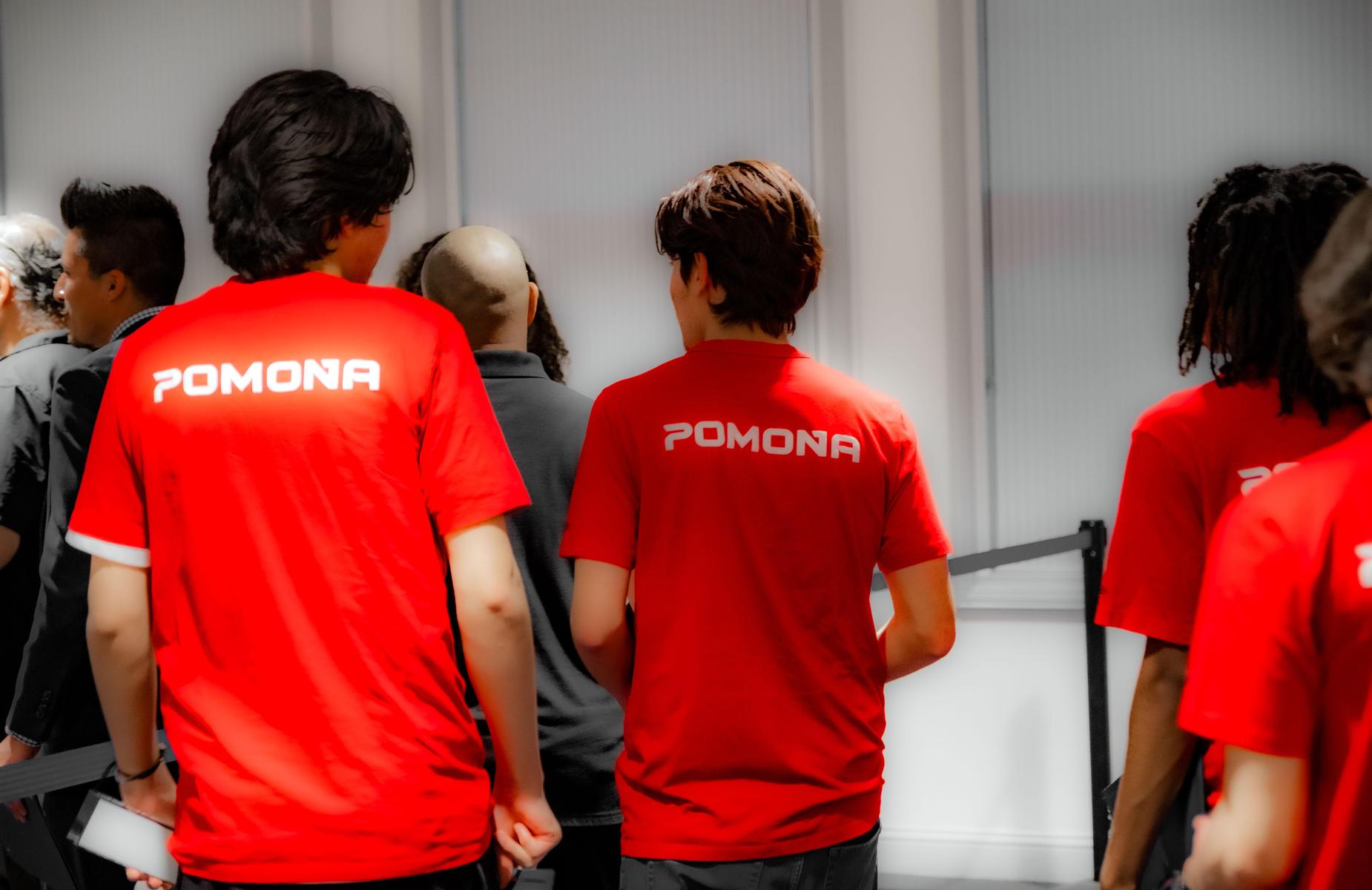 about four students wearing red shirts