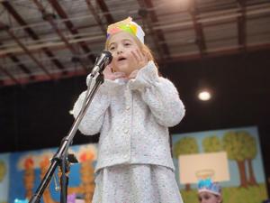a student reciting a hebrew poem.