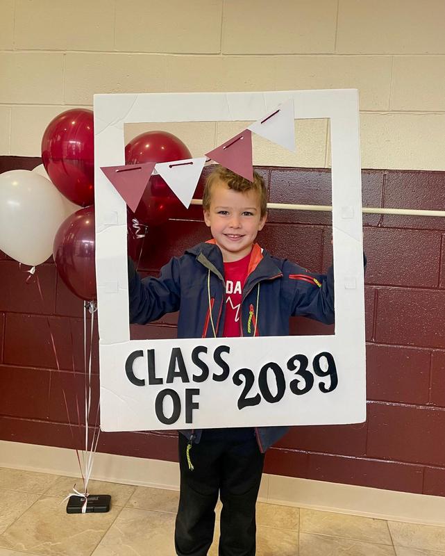 student standing with class of 2039 sign