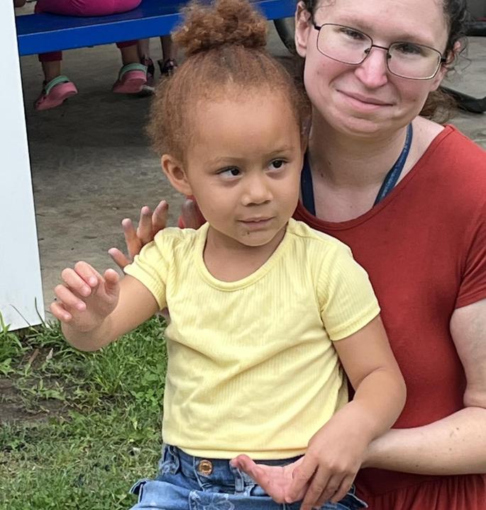 child and teacher playing