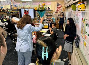 Left: Superintendent Angela Elizondo Baxter surprises Arroyo Vista 4th Grade Teacher Jennifer Simon (back right corner) with the District Teacher of the Year honor. (Photo Courtesy of SPUSD)