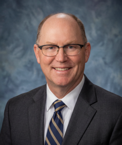 A headshot photo of former Pioneer High School science teacher Martin Mathews.