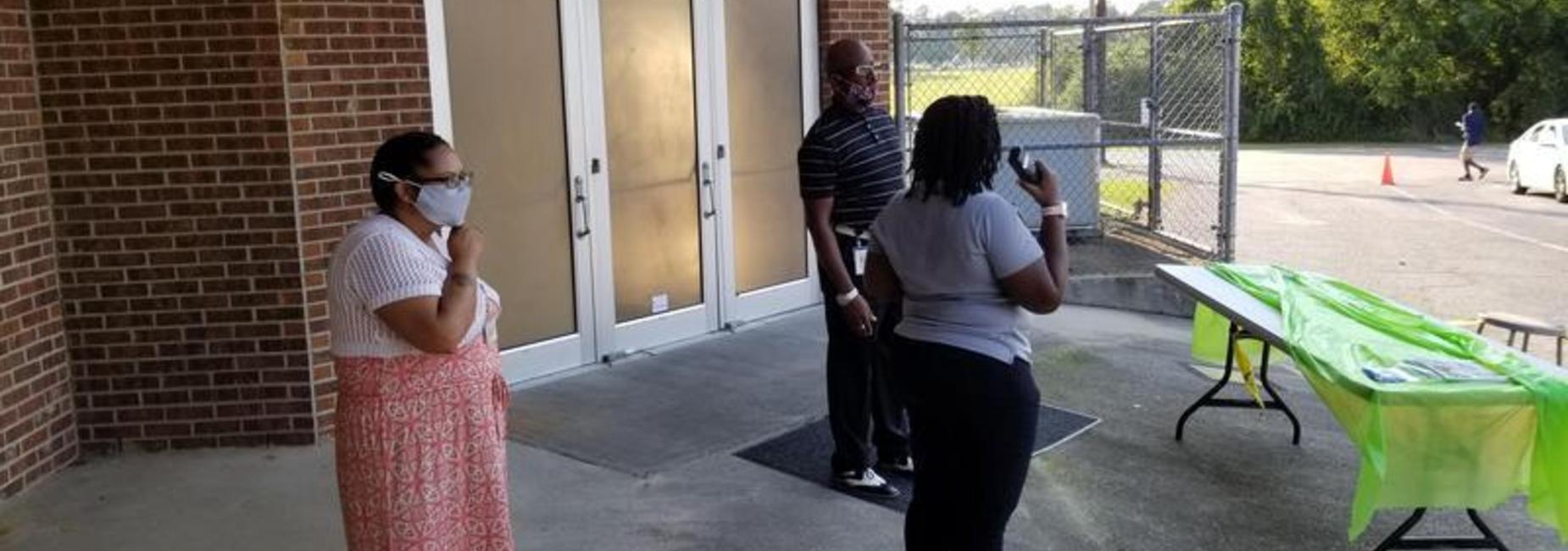 DS Johnson Elementary School Leaders standing outside the Media Center during the Open House Drive Through Experience