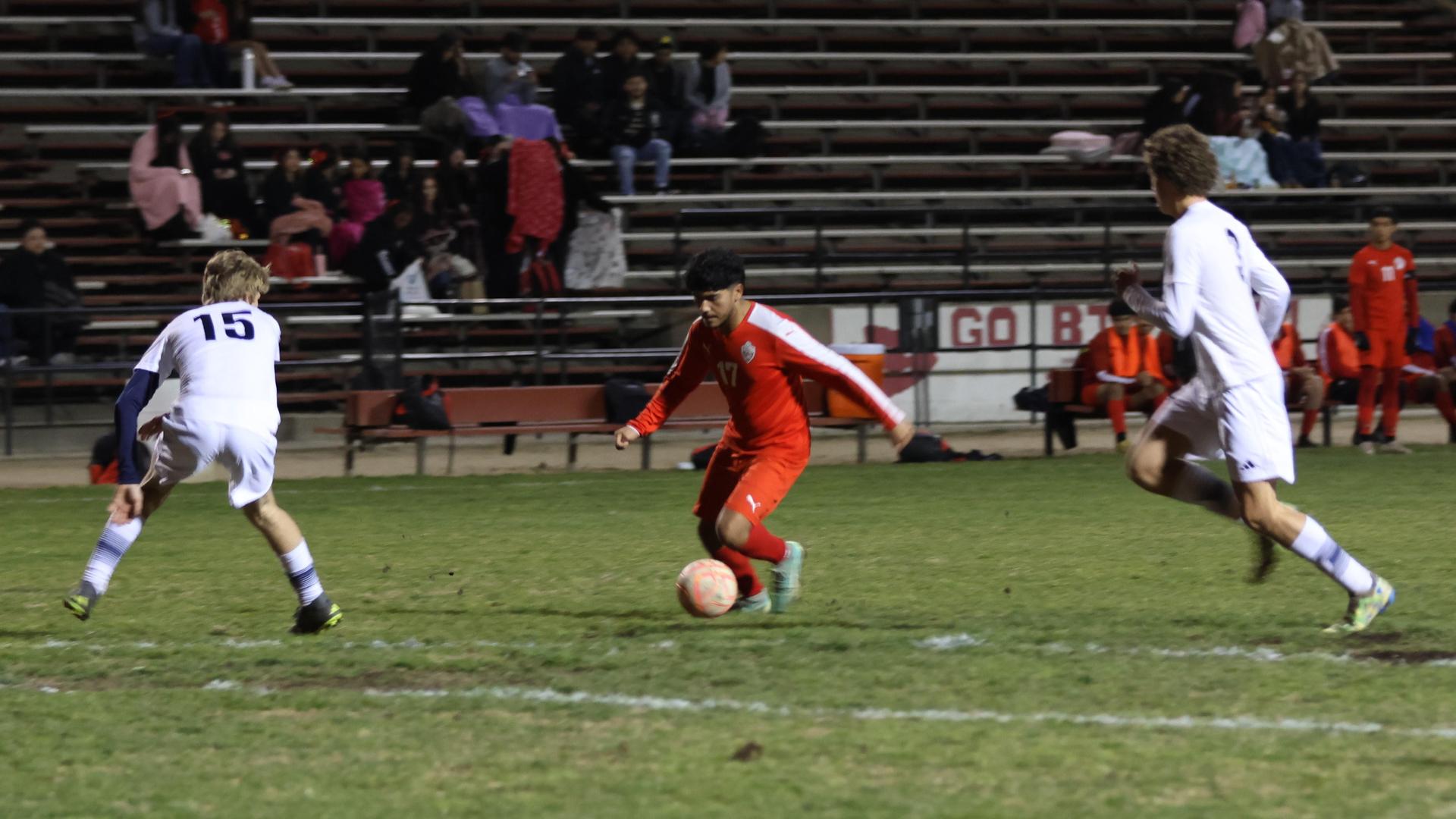 varisty boys soccer playing against yosemite