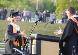 McKenna Hoebeke leads the class in the tassel ceremony.
