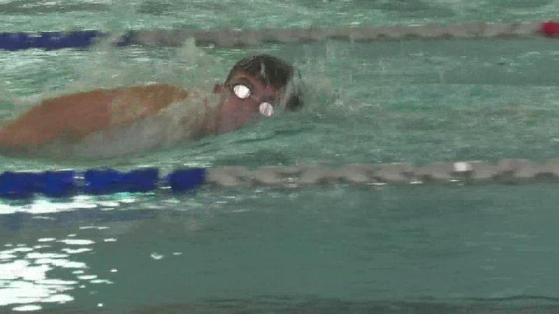 Swimming with ripped tendon, muscle and bone, 14-year-old wins state title with Holy Cross Featured Photo