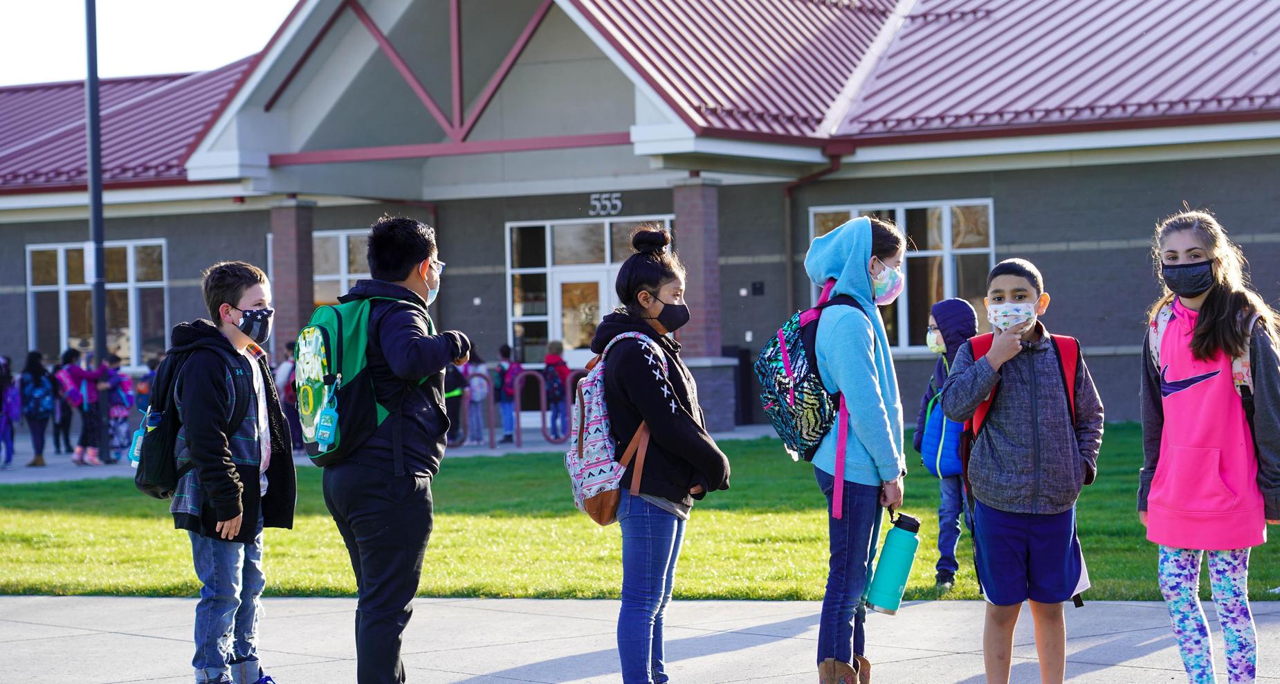 Students lined up outside of the school.