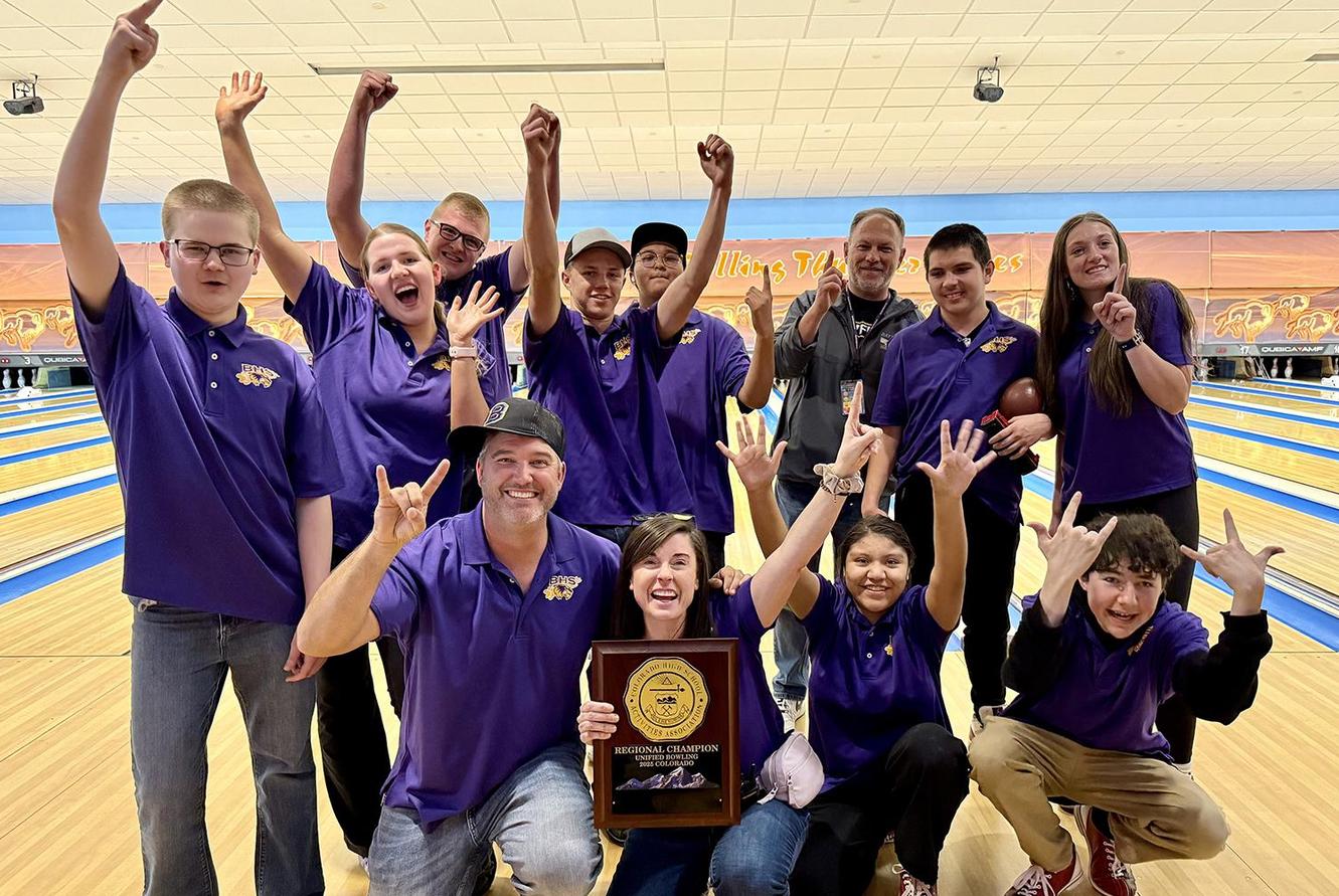The Unified Bowling team celebrates with their trophy.