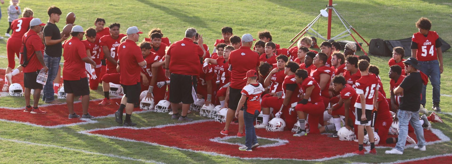  junior varsity football players in action against riverdale