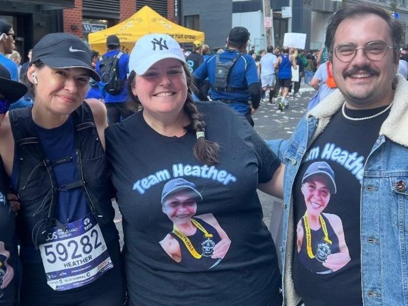 4 adults standing together