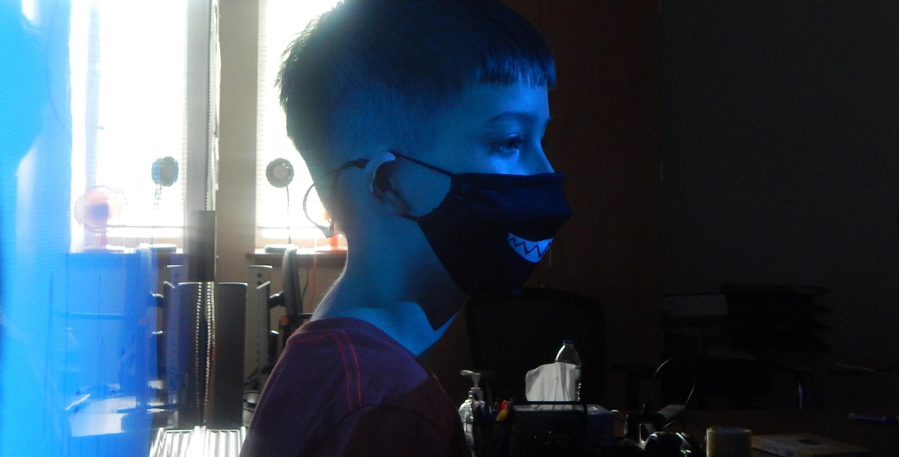Child inside with mask