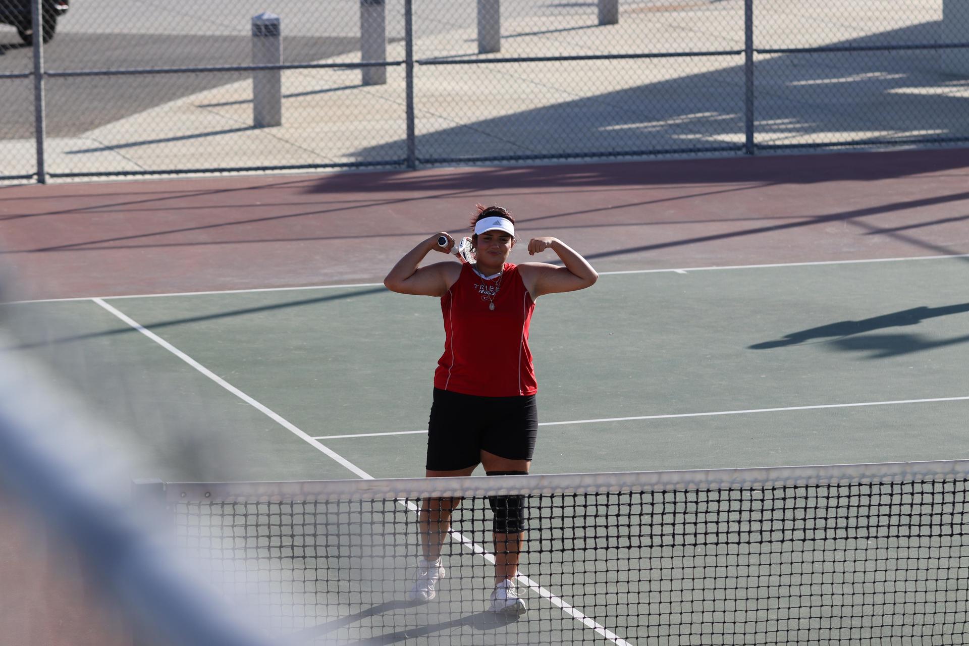 tennis players, family, and staff celebrating senior night